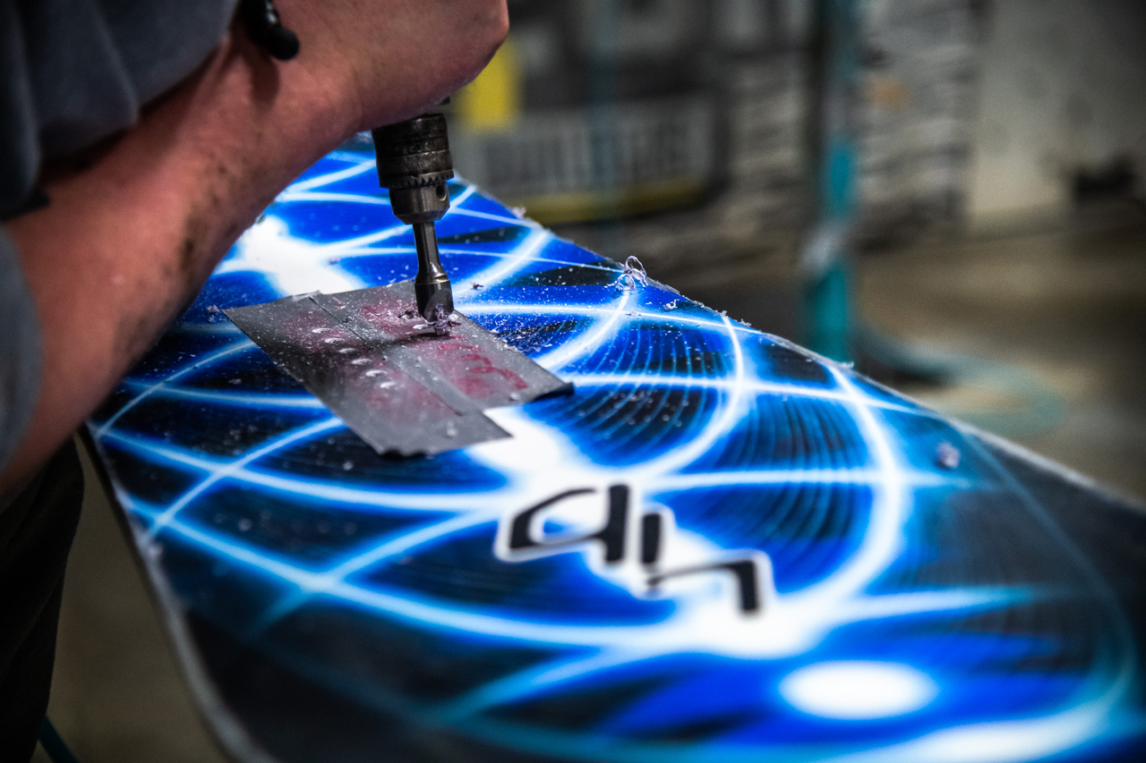 Tim McCabe drilling inserts of Orca Snowboard