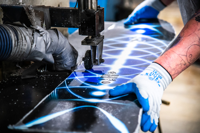 Tim McCabe putting an edge bevel on the Orca Snowboard